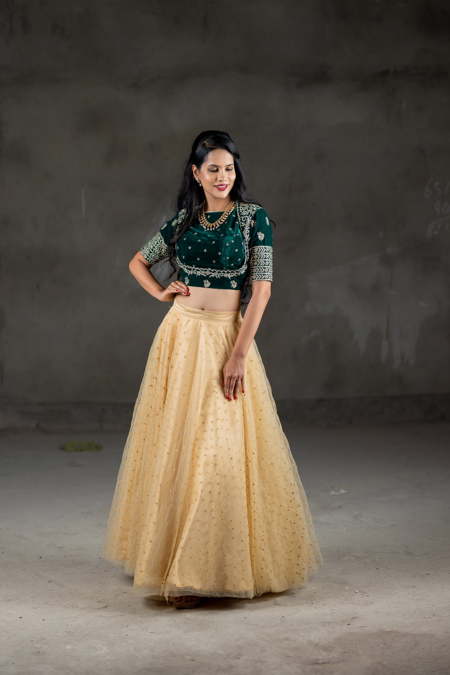 Green beautiful velvet blouse with embroidery work and cream skirt