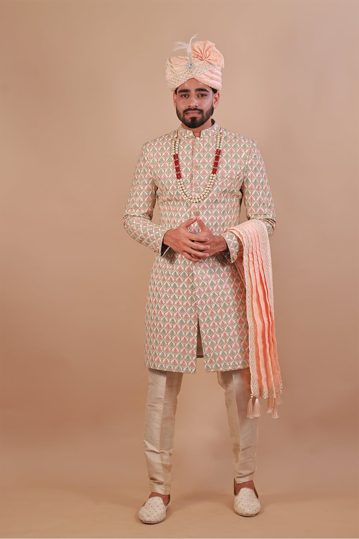 Groom's White Sherwani with Vibrant Pink & Gold Thread Work