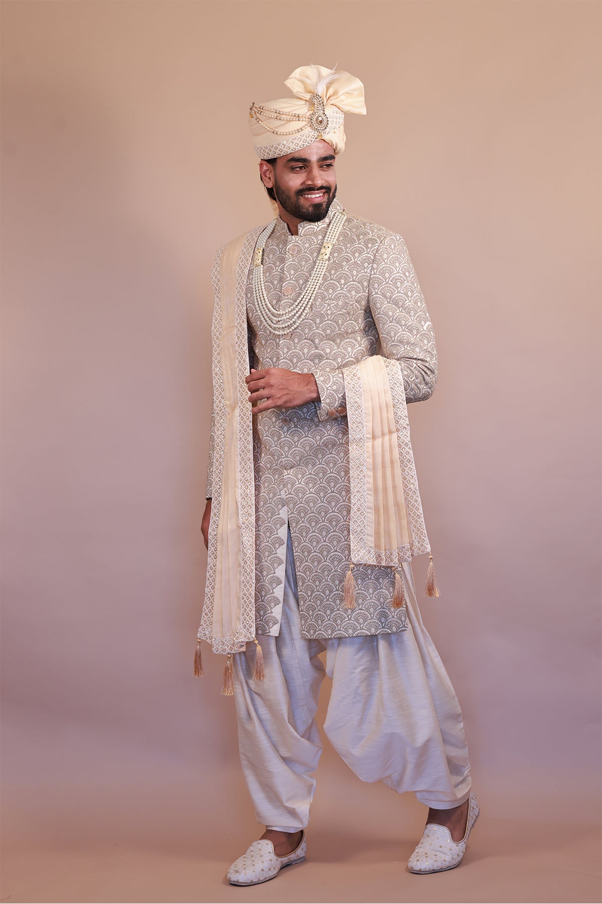 Cream Sherwani with Intricate Pink & Gold Embroidery for Grooms