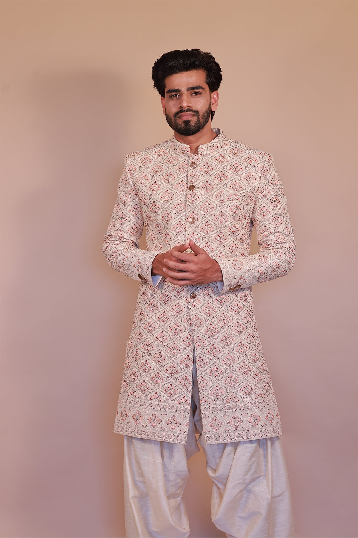 Cream Sherwani for Grooms with Stunning Orange-Gold Detailing