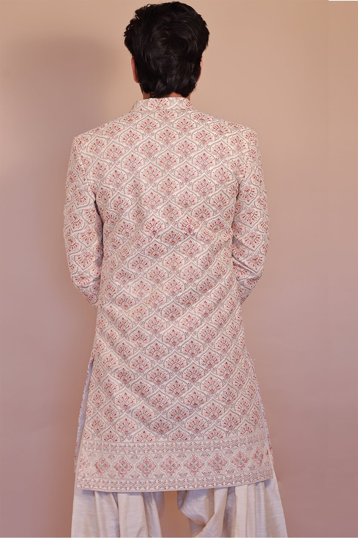 Cream Sherwani for Grooms with Stunning Orange-Gold Detailing