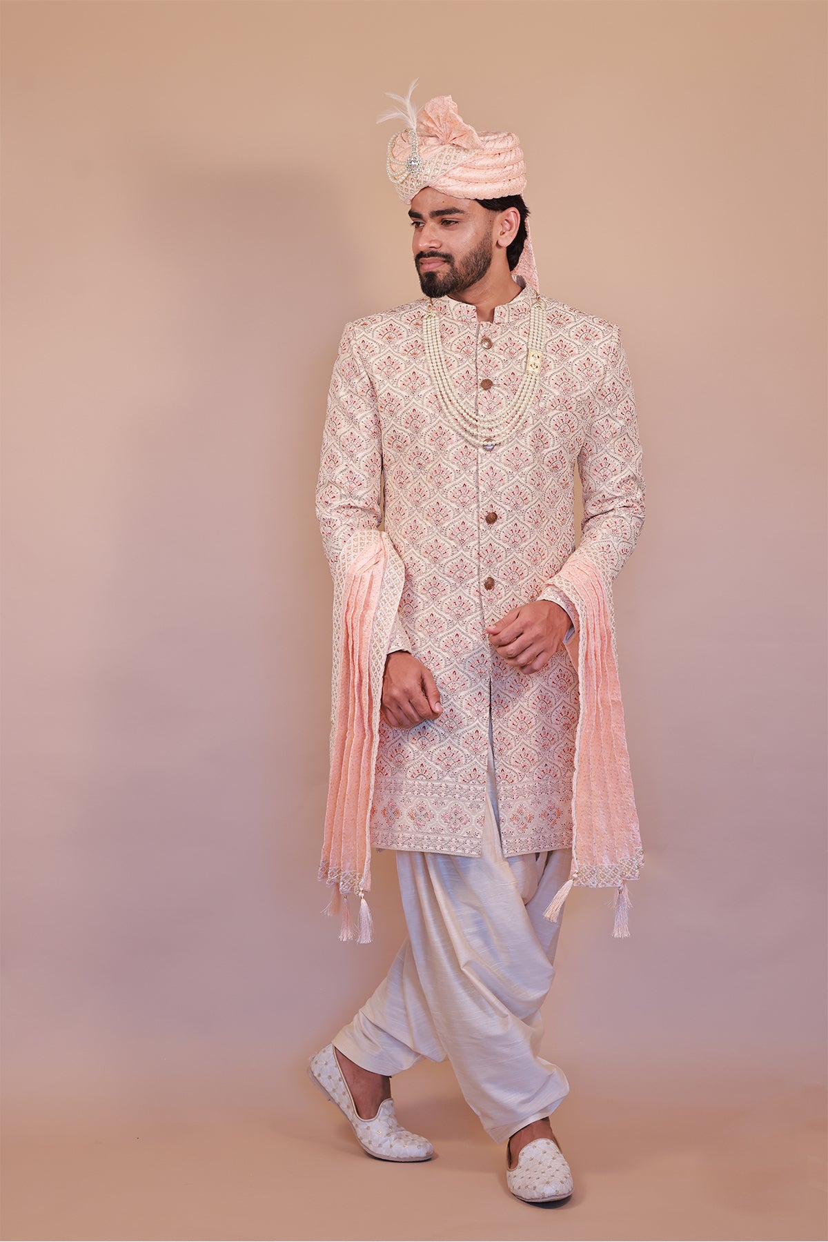 Cream Sherwani for Grooms with Stunning Orange-Gold Detailing