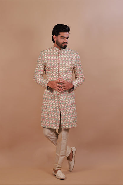 Groom's White Sherwani with Vibrant Pink & Gold Thread Work