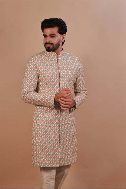 Groom's White Sherwani with Vibrant Pink & Gold Thread Work