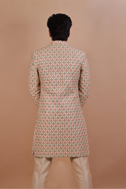 Groom's White Sherwani with Vibrant Pink & Gold Thread Work