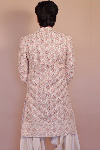 Cream Sherwani for Grooms with Stunning Orange-Gold Detailing