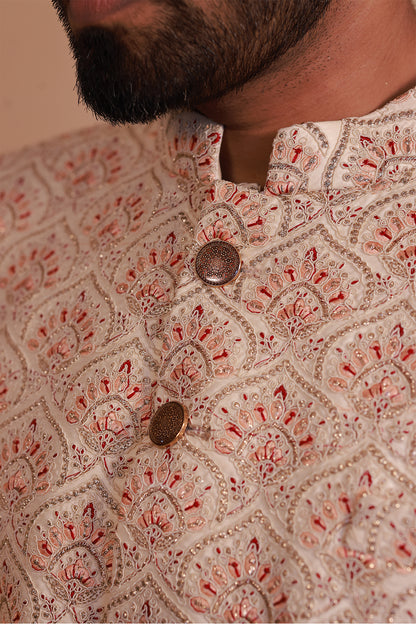 Cream Sherwani for Grooms with Stunning Orange-Gold Detailing