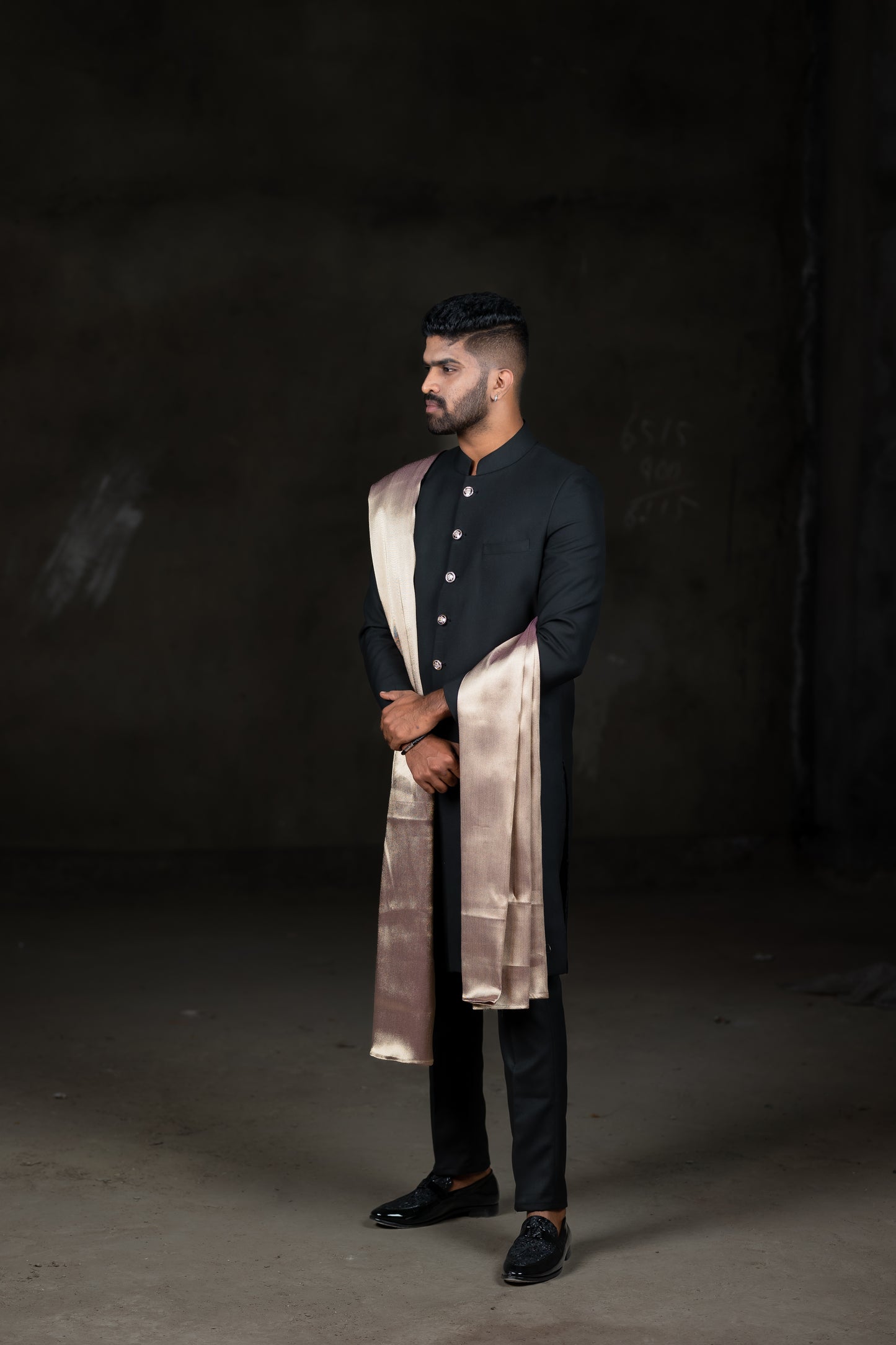 Black sherwani with onion pink silk dupatta